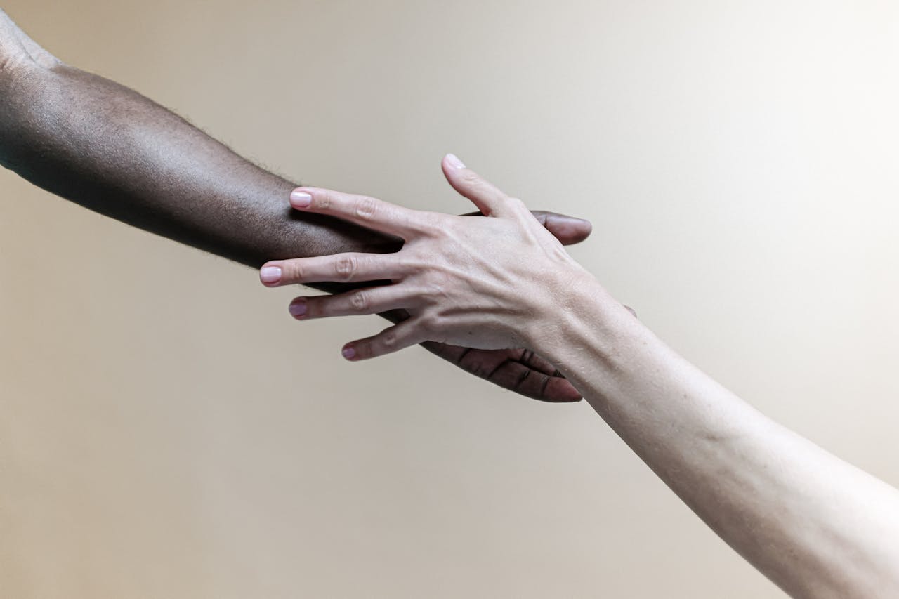 Photo Of People's Left Hands